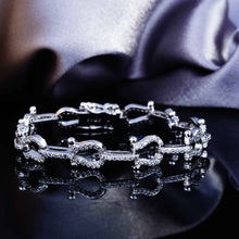 Load image into Gallery viewer, Micro-encrusted Horseshoe Diamond Bracelet
